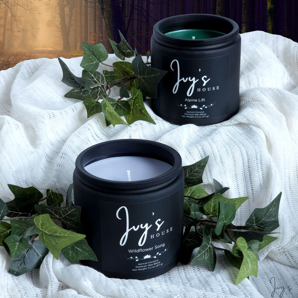 Enchanted Haze candle collection by Ivy’s House with Alpine Lift and Wildflower Song in a magical forest-inspired setting