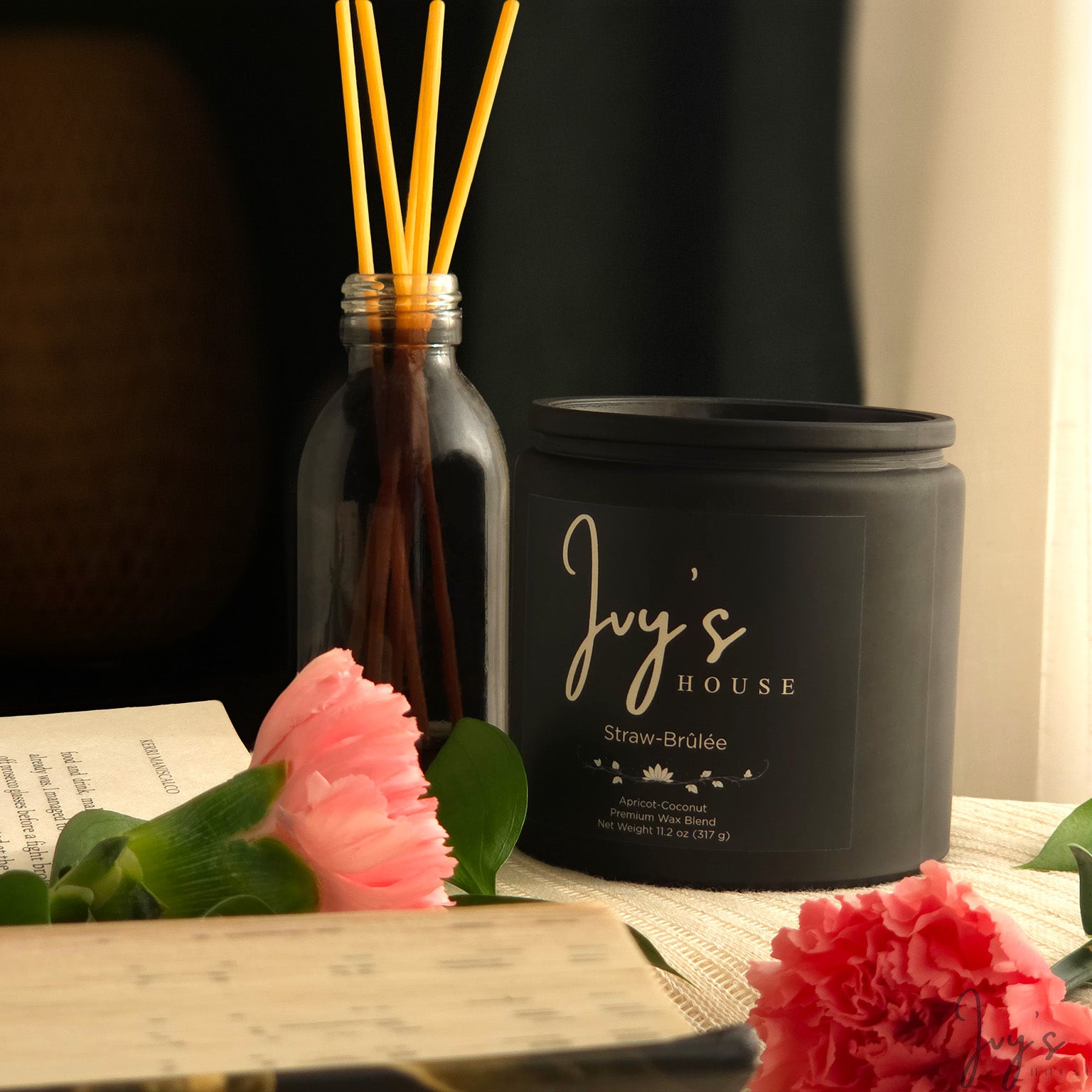 Straw-Brûlée candle by Ivy’s House with diffuser, flowers, and soft natural light