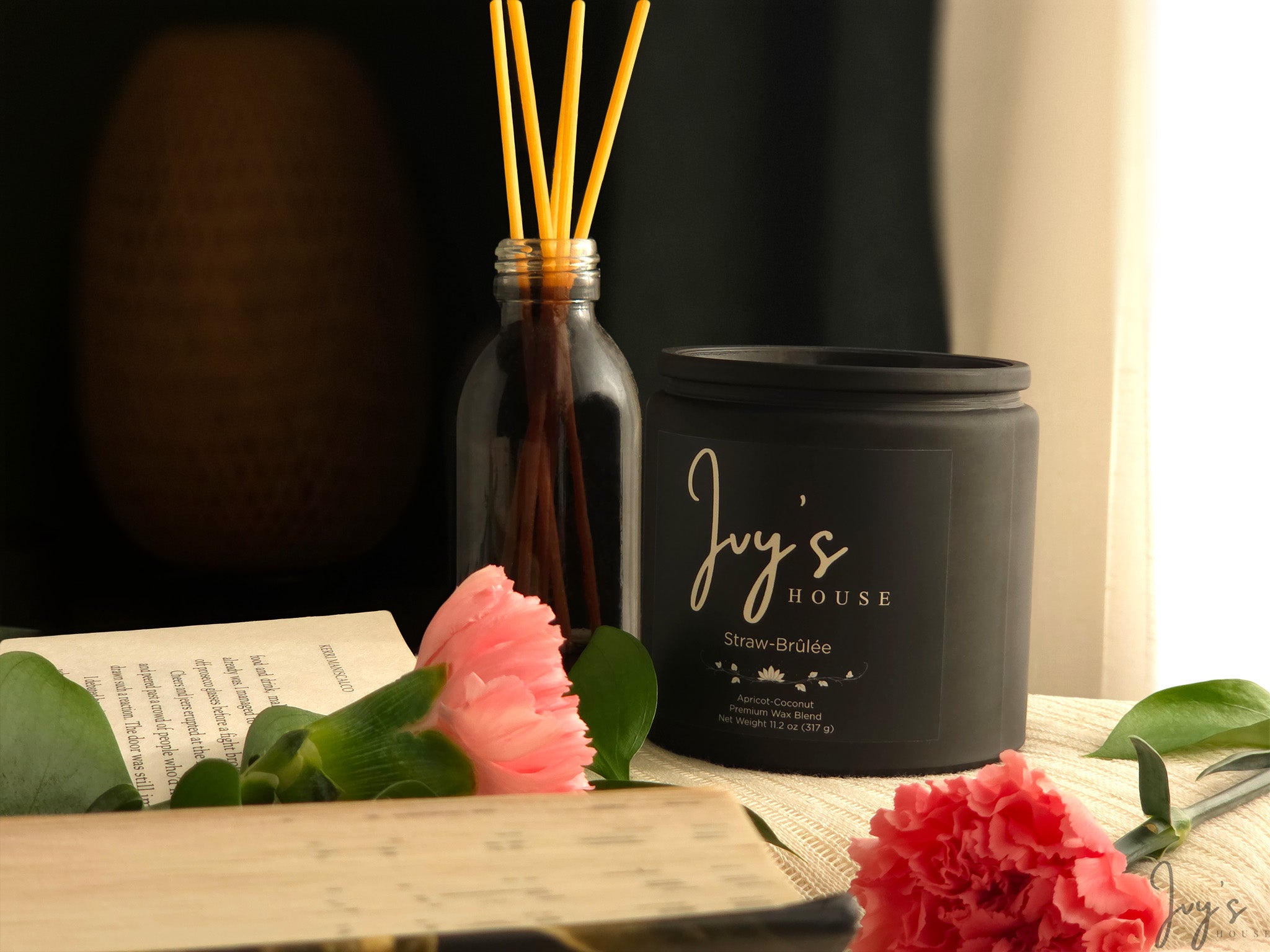 Straw-Brûlée candle by Ivy’s House with diffuser, flowers, and soft natural light