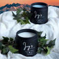 Twilight Ridge candle collection by Ivy’s House with Vanilla Rain and Wandering Willow on soft fabric with mountain backdrop